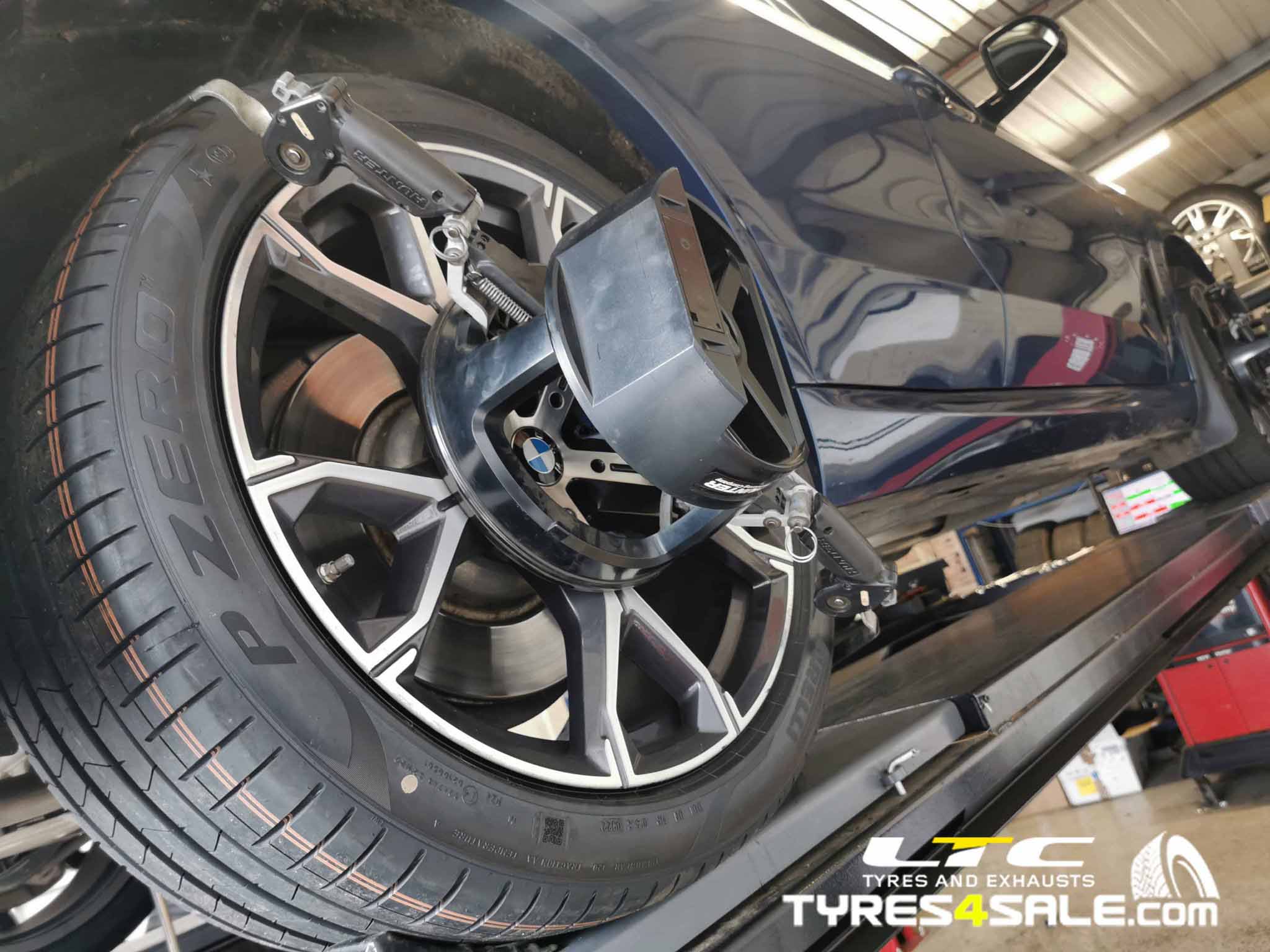 Vehicle undergoing Hunter HawkEye wheel alignment at LTC Tyres and Exhausts