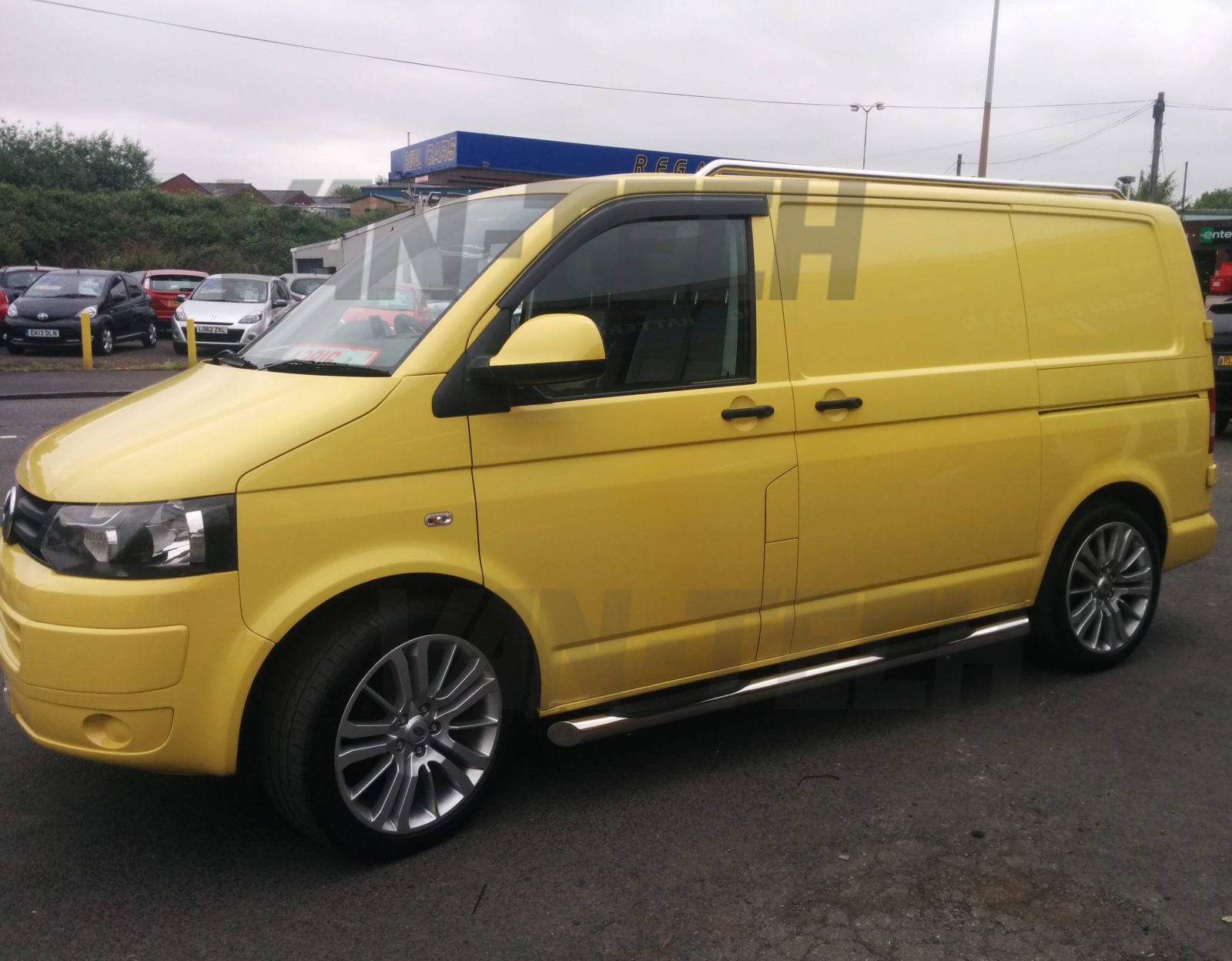 VW-transporter-T5-with-3-step-stainless-steel-side-bars-and-stainlees-steel-roof-rails VW T5 SWB LWB Slashed End Side Bars with Three Steps stainless steel with slash cut end.