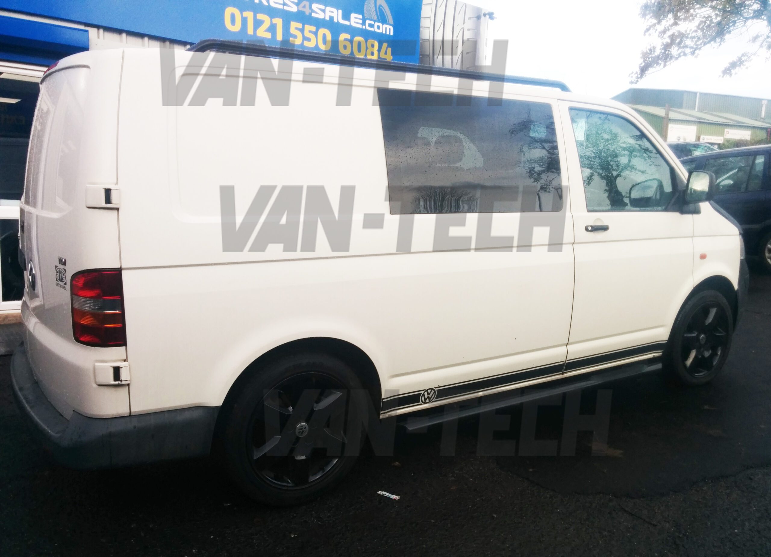 vw-transporter-t5-t5.1-and-t6-black-side-bars-with-3-steps-2-scaled VW T5 SWB LWB Transporter Black Slashed End Side Bars with Three Steps.