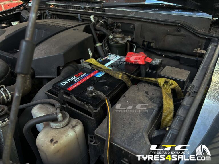 New car battery connected in the engine bay by LTC Tyres and Exhausts