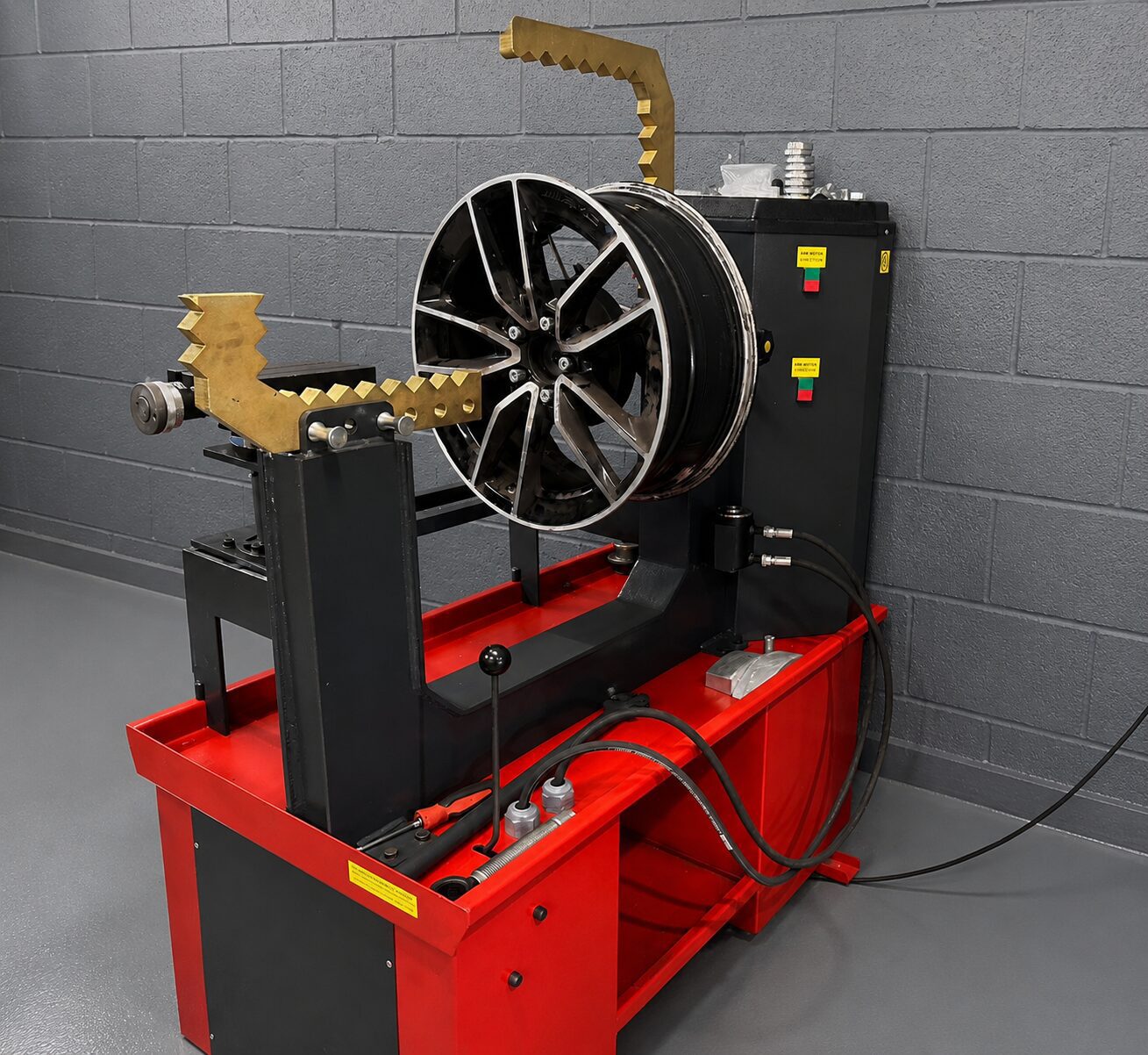 Alloy wheel buckle being repaired on a wheel straightening machine at LTC Tyres and Exhausts