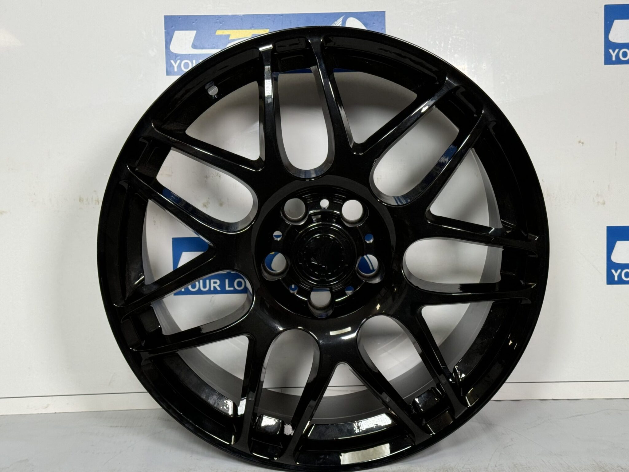 Gloss black powder coated alloy wheel refurbished by LTC Tyres and Exhausts