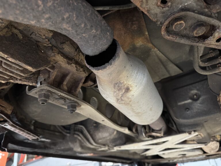 Broken centre exhaust section requiring exhaust repair or replacement